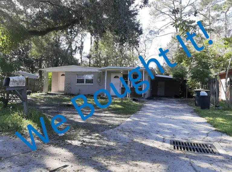 Small house under oak trees that Atlantic Property Buyers bought