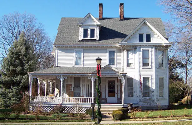 Older two-story house with a front porch, a typical inherited property